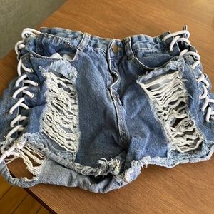 Gently used size M but runs small distressed lace up shorts